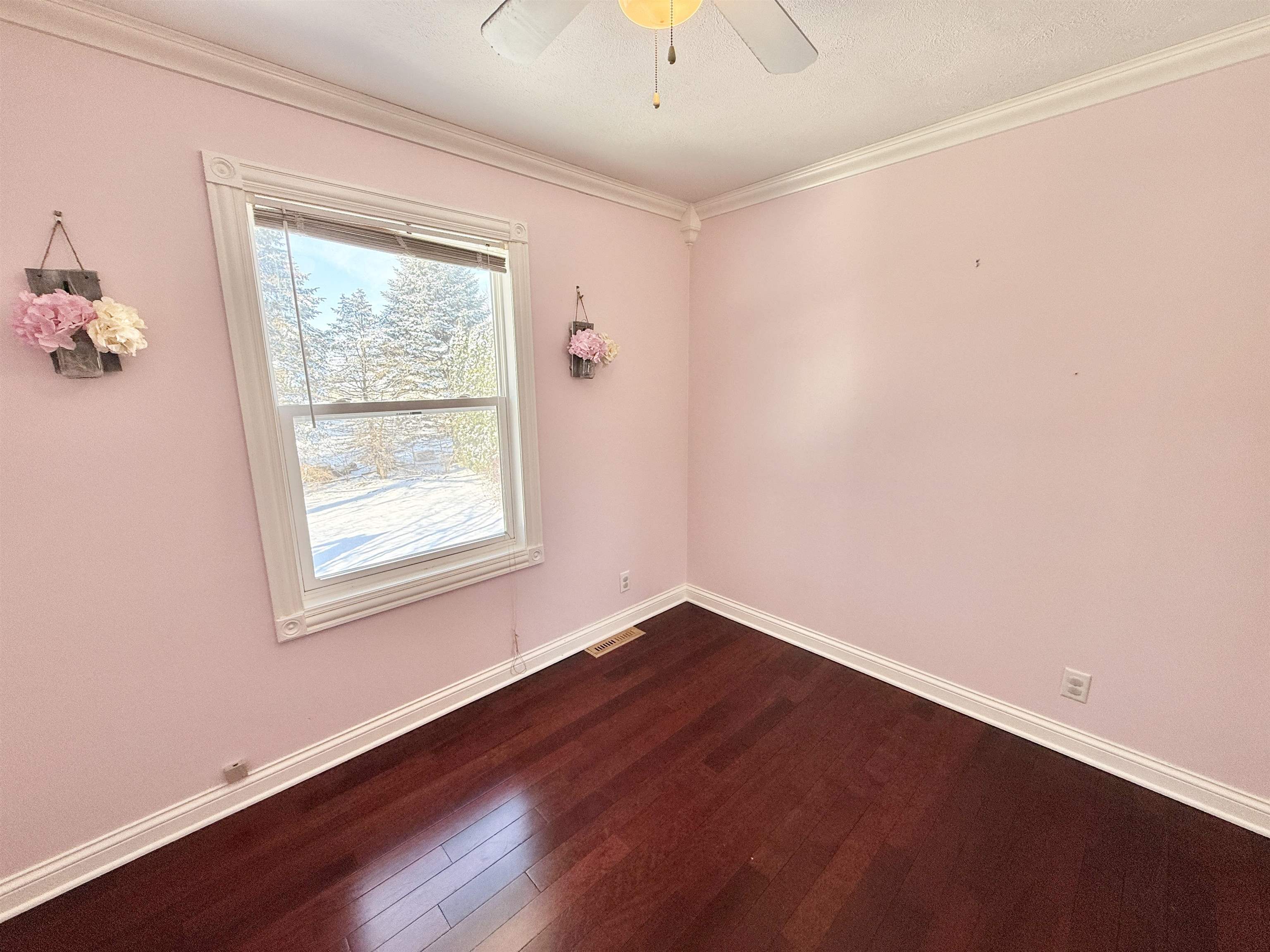 120 Lamplighter Loop Southeast Poplar Grove, IL 61065 - Photo 26 of 30 a view of an empty room with wooden floor and a window