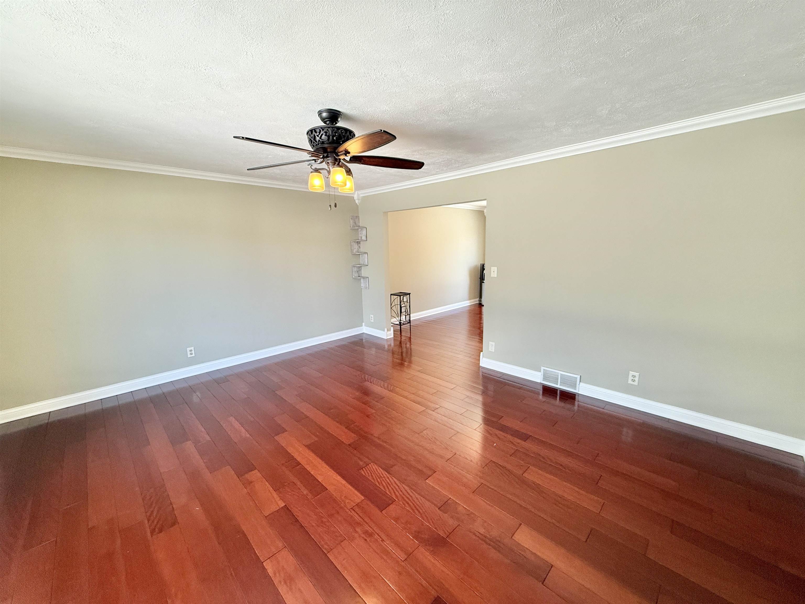 120 Lamplighter Loop Southeast Poplar Grove, IL 61065 - Photo 6 of 30 an empty room with wooden floor and windows