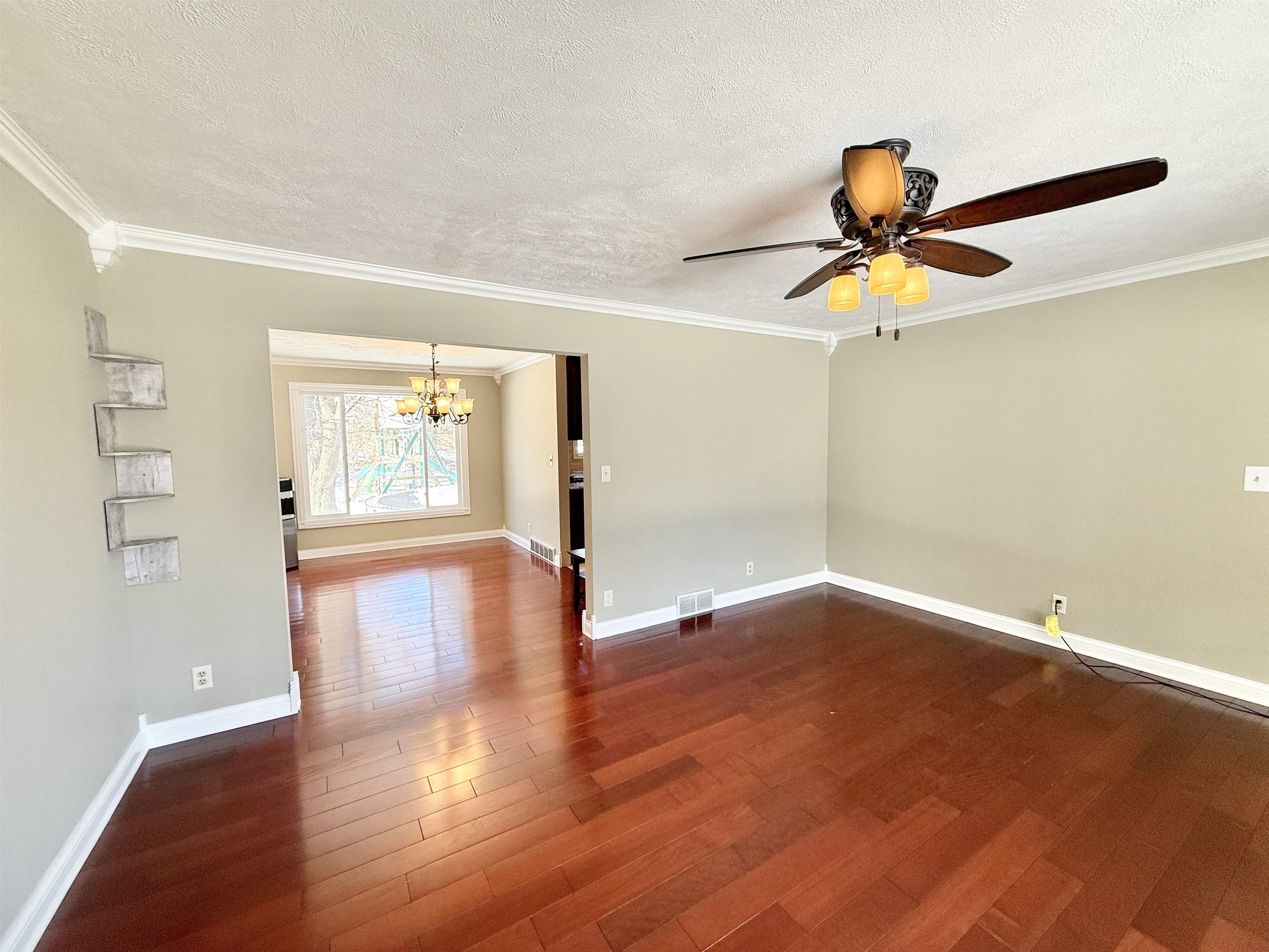 120 Lamplighter Loop Southeast Poplar Grove, IL 61065 - Photo 7 of 30 a view of empty room with wooden floor and fan