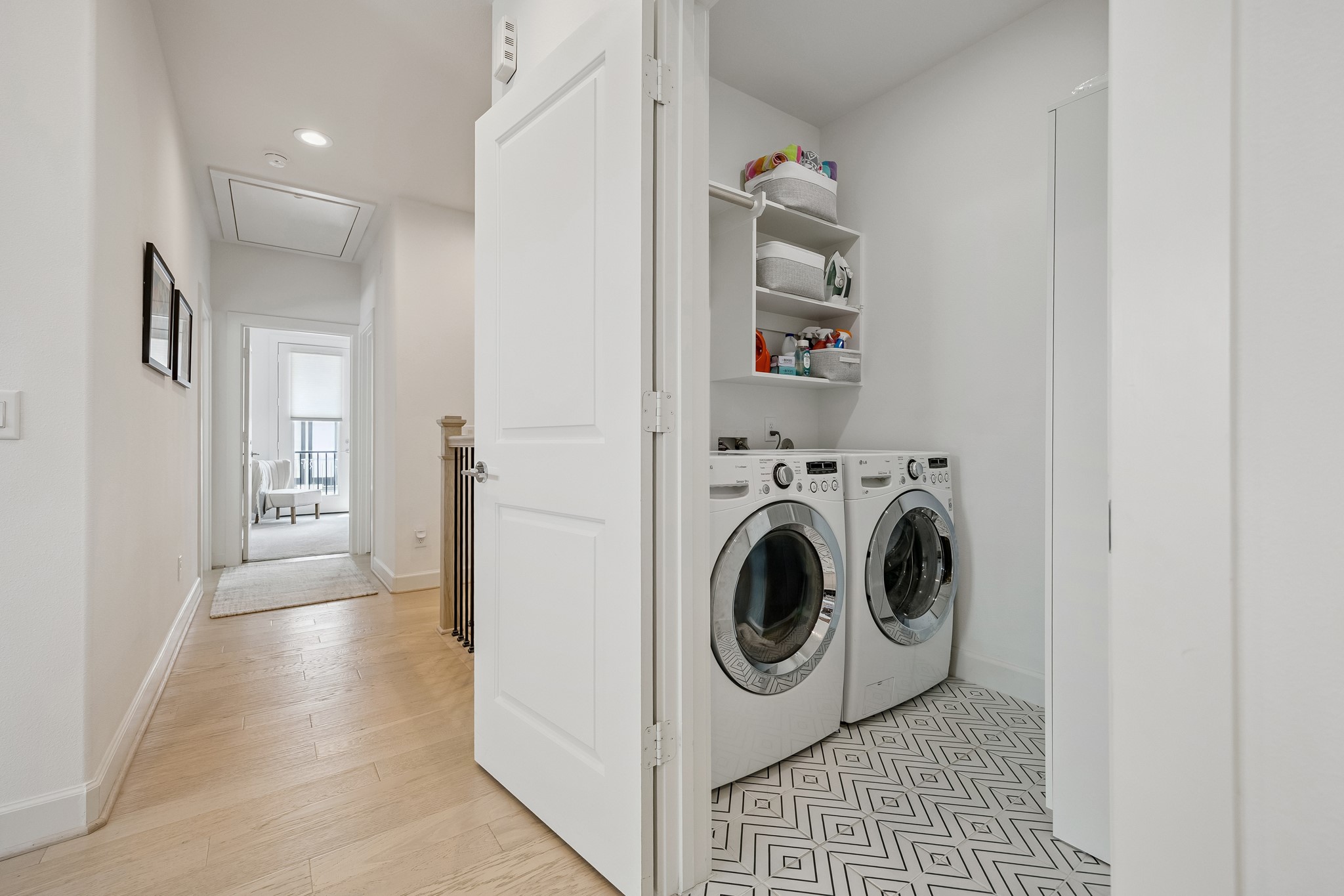 1747 Ojeman Point Lane Houston, TX 77055 - Photo 20 of 24 The utility room features built-in shelves and an additional cabinet for storage.