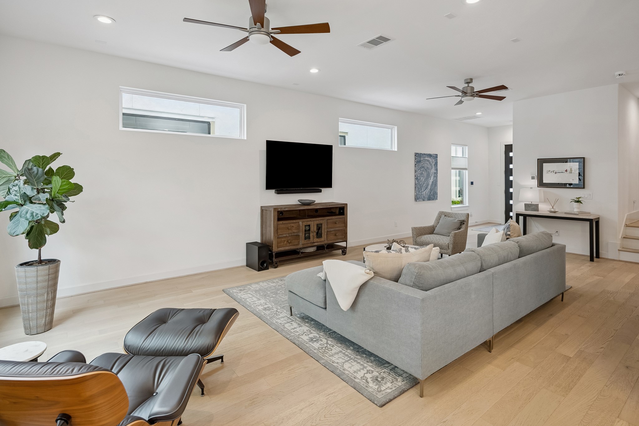 1747 Ojeman Point Lane Houston, TX 77055 - Photo 5 of 24 When you enter the home, you’re welcomed into an open-concept living and kitchen area.