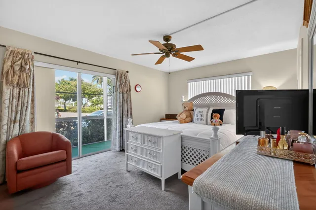 a bed room with a bed couch and a window