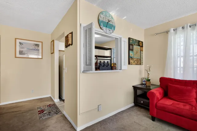 a living room with furniture and a gate
