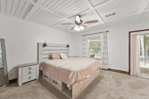 a bathroom with a double vanity sink mirror and shower