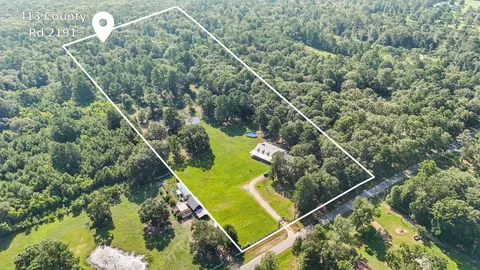 a view of outdoor space with swimming pool and green space