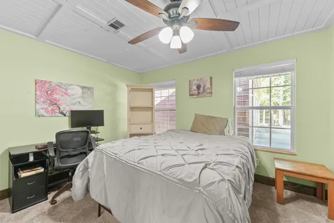 a bathroom with sinks granite countertop tub and a sink