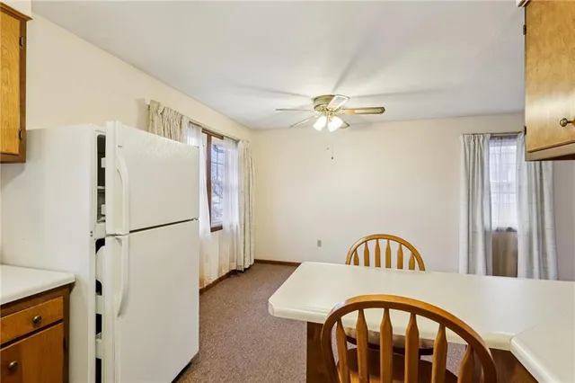 a very nice looking dining room with a kitchen