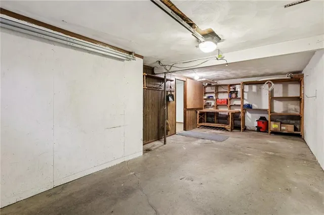 a view of a garage with cars and a garage