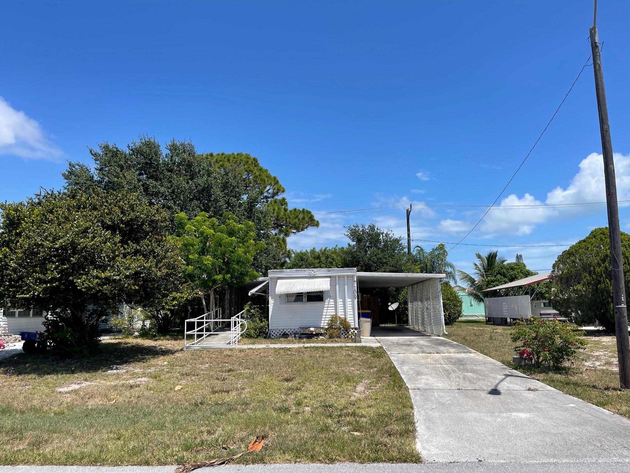 7109 Southeast Ridgeway Terrace Hobe Sound, FL 33455 - Photo 1 of 11 Exterior Front