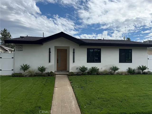 a front view of house with garden