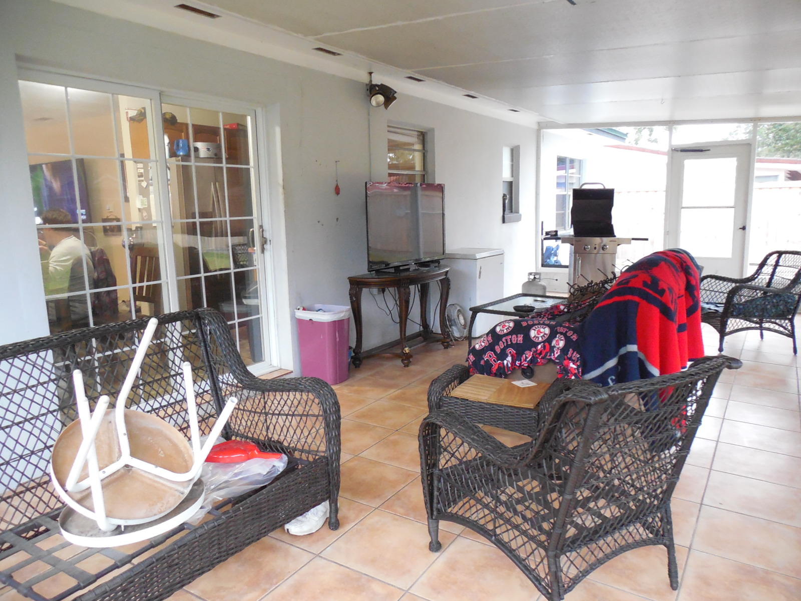 419 Marlowe Drive Fort Walton Beach, FL 32547 - Photo 4 of 12 a living room with furniture a flat screen tv and floor to ceiling window
