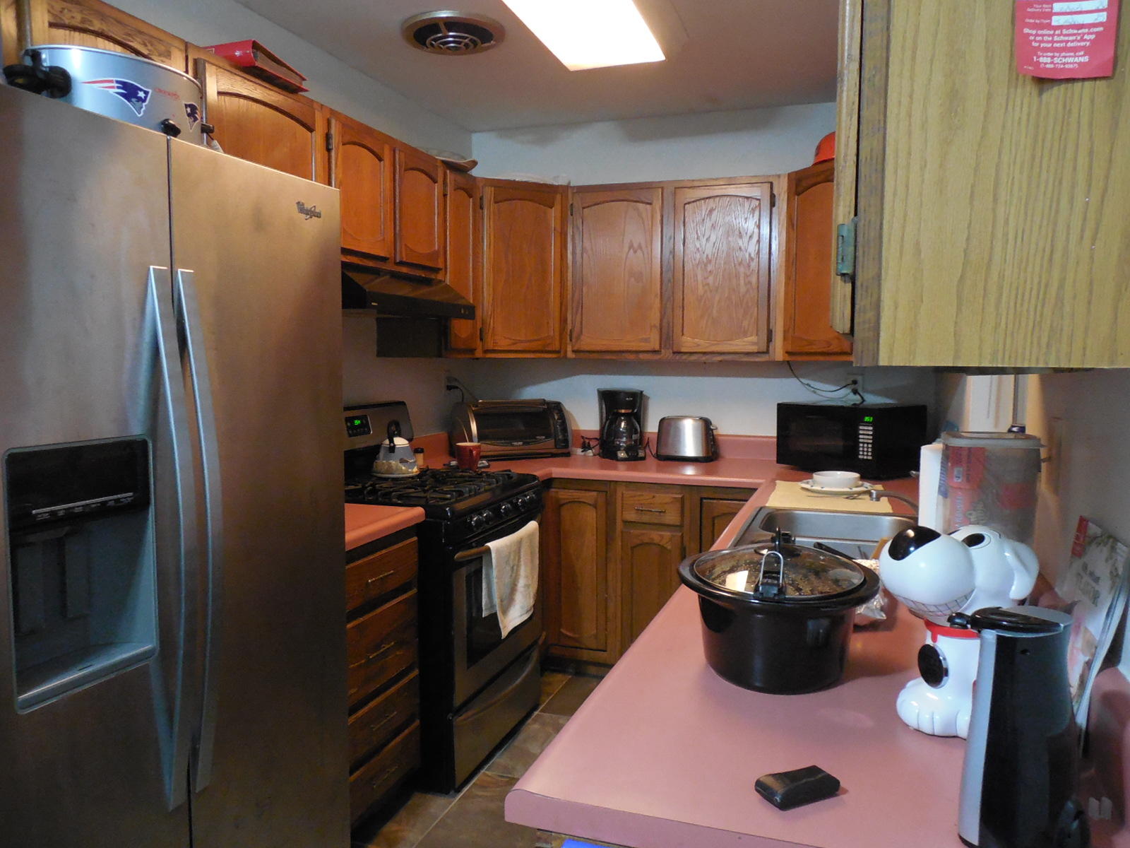 419 Marlowe Drive Fort Walton Beach, FL 32547 - Photo 5 of 12 a kitchen with a refrigerator and a stove top oven