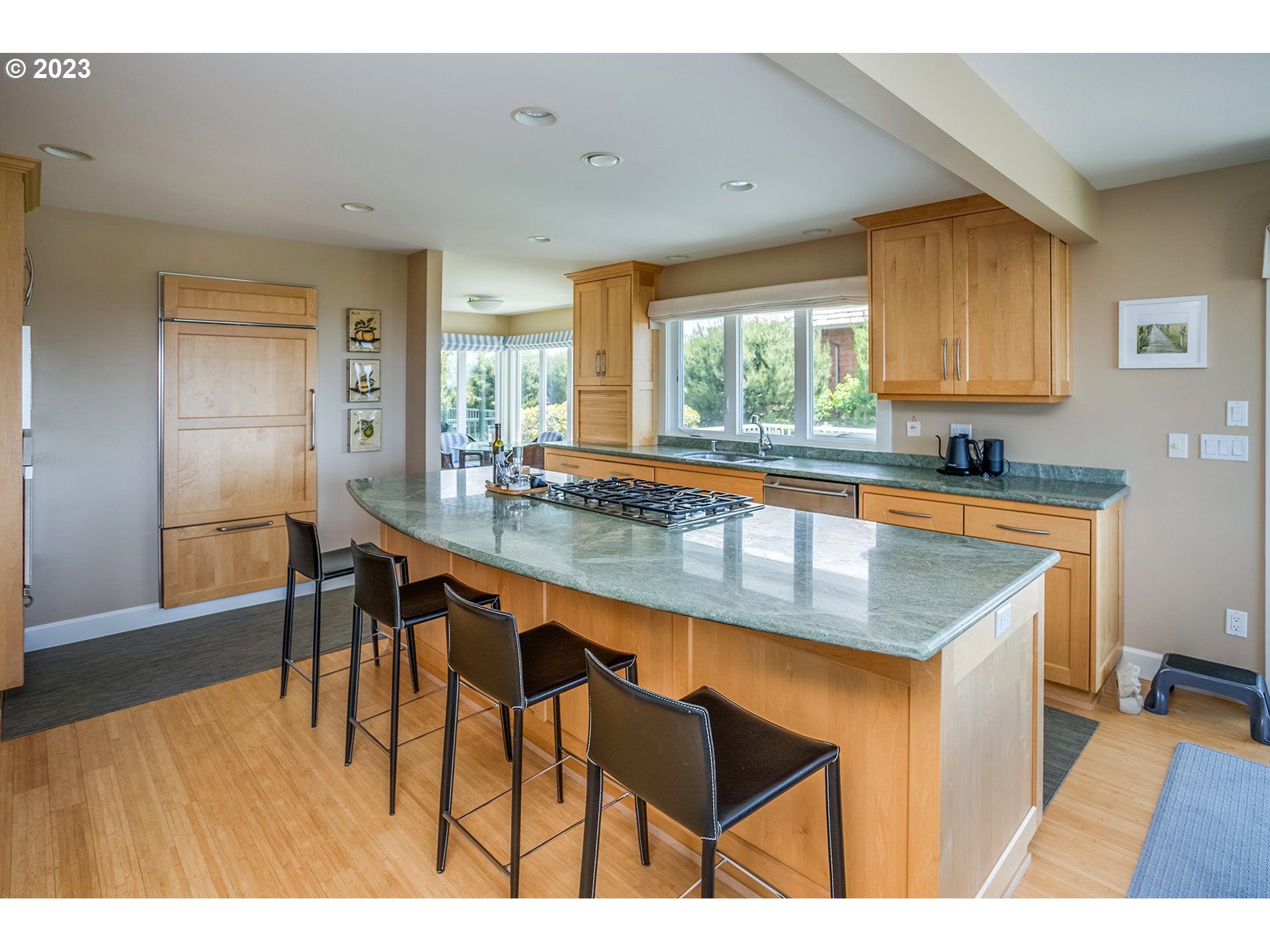 4710 High Ridge Road Gearhart, OR 97138 - Photo 11 of 44 a kitchen with stainless steel appliances granite countertop counter space a sink and a refrigerator