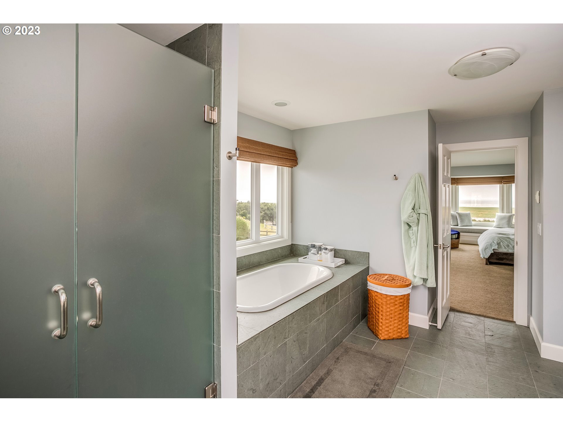4710 High Ridge Road Gearhart, OR 97138 - Photo 23 of 44 a bathroom with a sink a toilet and shower