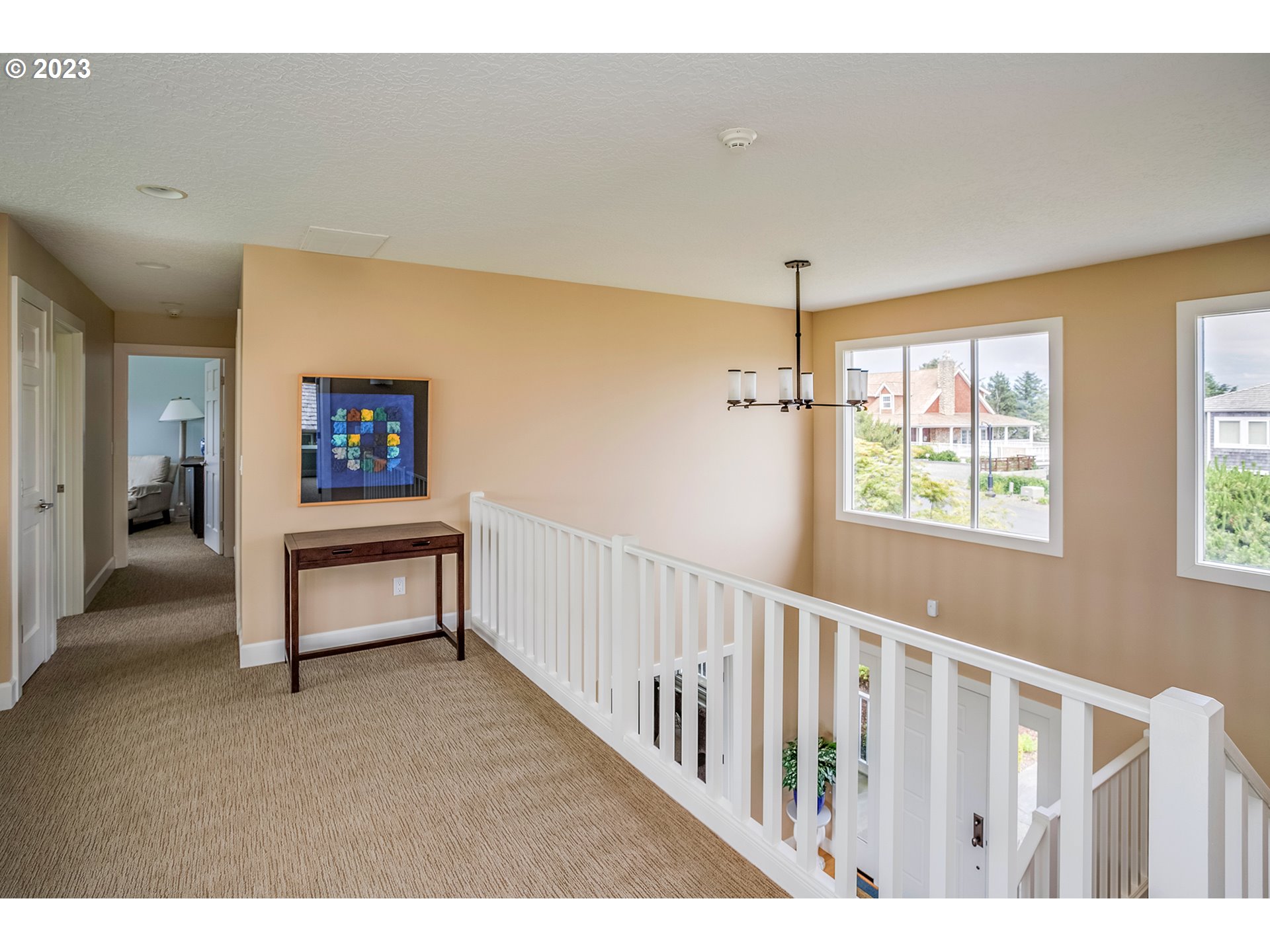 4710 High Ridge Road Gearhart, OR 97138 - Photo 26 of 44 a view of a hallway with furniture and window
