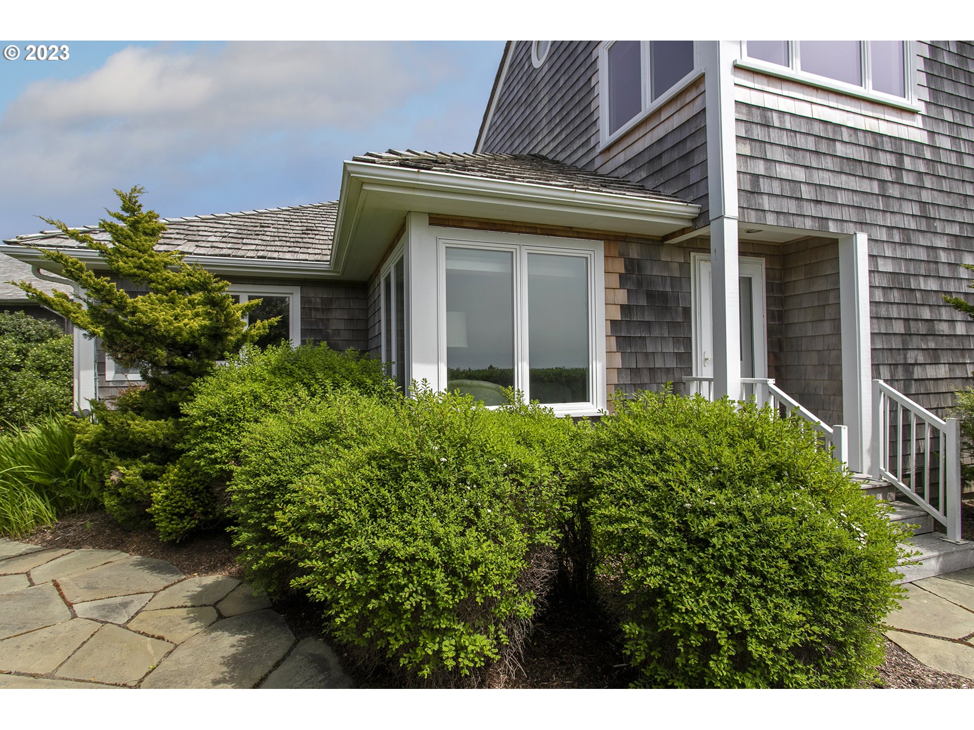 4710 High Ridge Road Gearhart, OR 97138 - Photo 33 of 44 a view of a house with potted plants