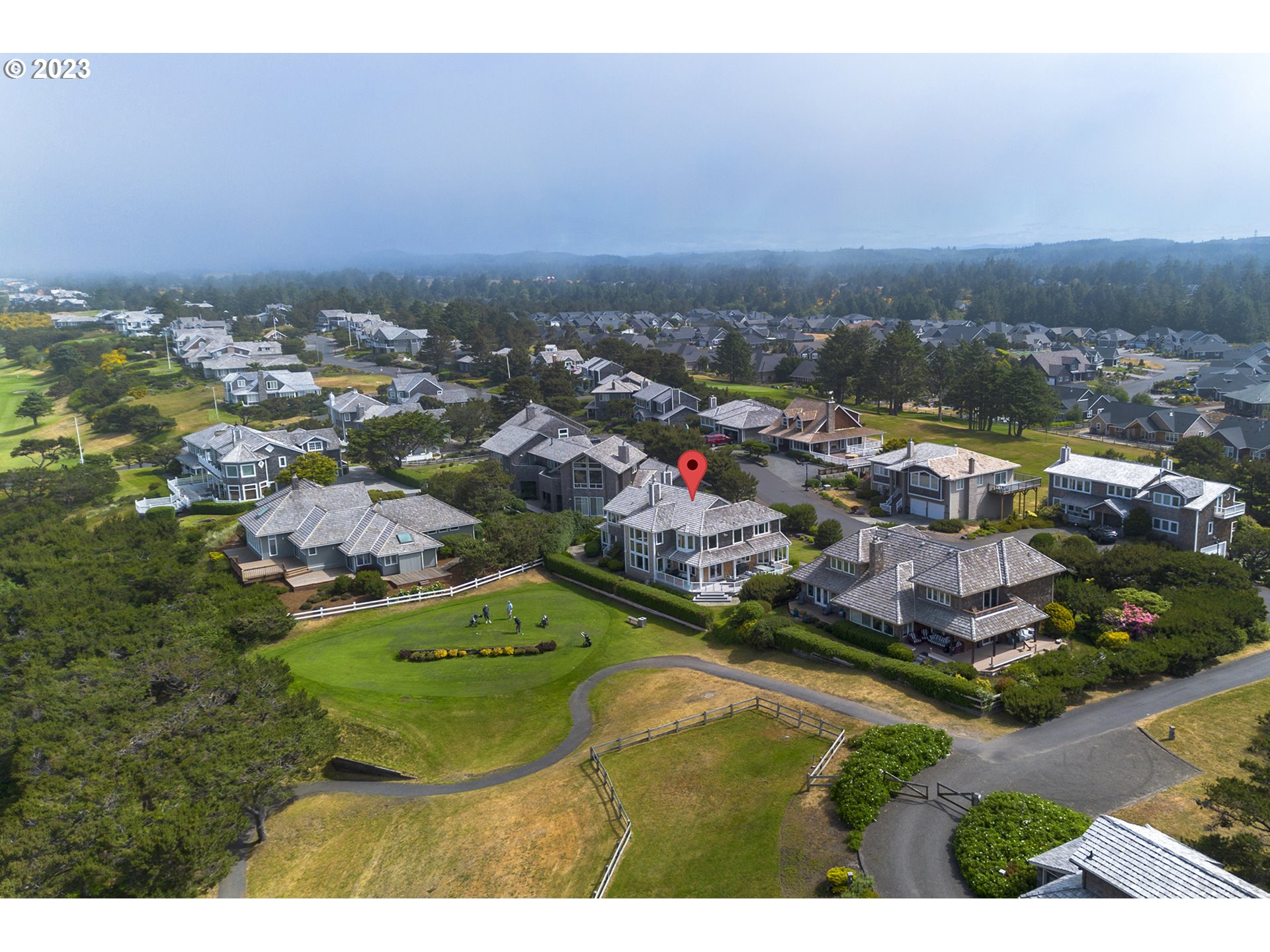 4710 High Ridge Road Gearhart, OR 97138 - Photo 42 of 44 an aerial view of residential houses with outdoor space and trees