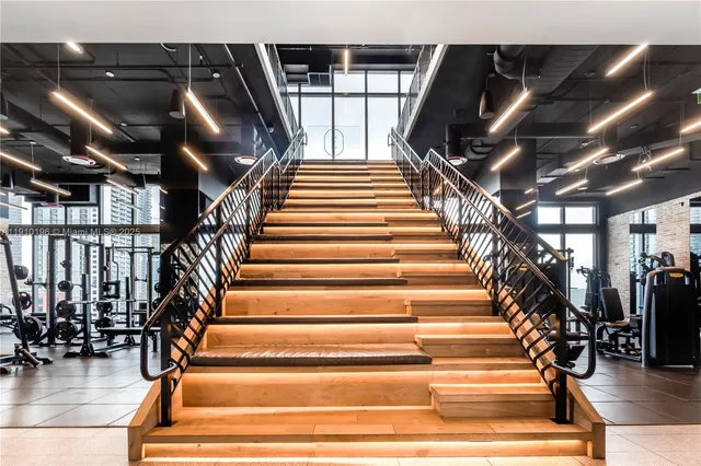 a view of a chairs and table in the balcony