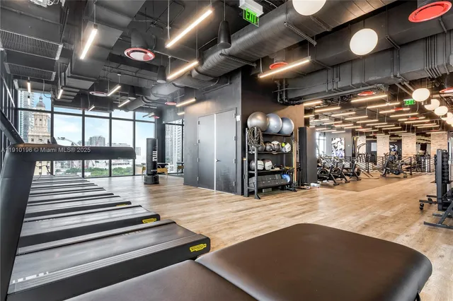 a view of a entryway door with potted plants