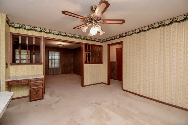 a kitchen with a stove and a refrigerator