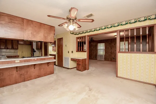 a kitchen with a refrigerator and a sink