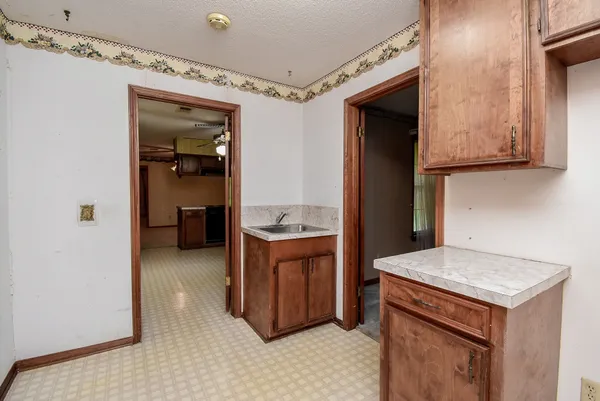 a front view of a house with yard and green space