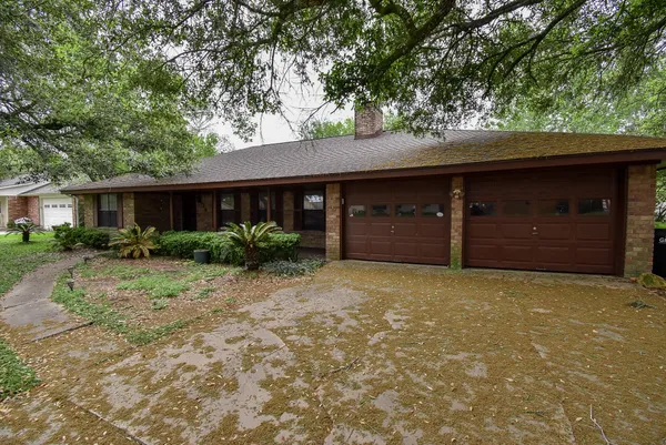a house with a tree in front of it