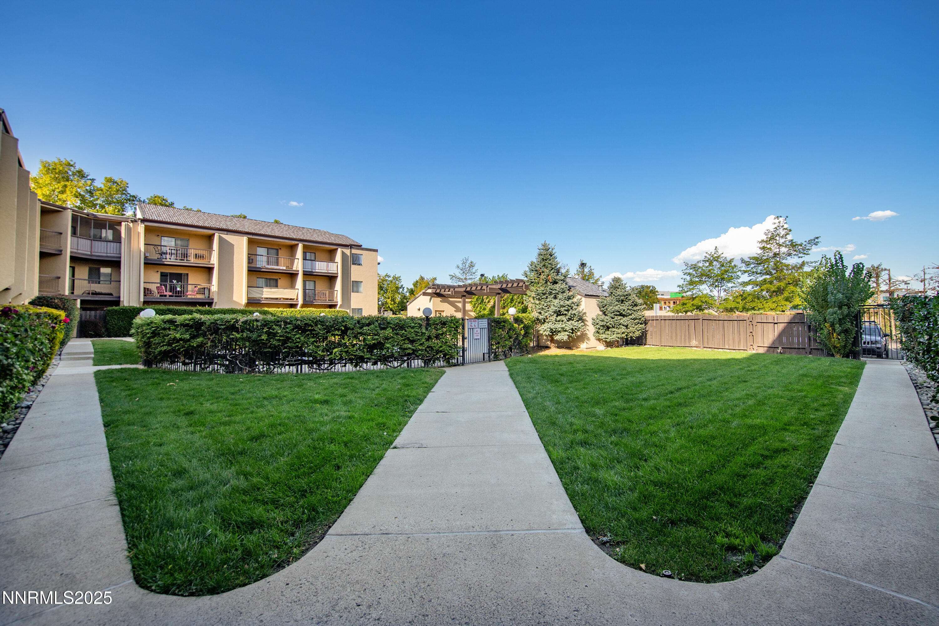 2450 Lymbery Street, Unit 213 Reno, NV 89509 - Photo 11 of 25 a view of a garden with a house in the background