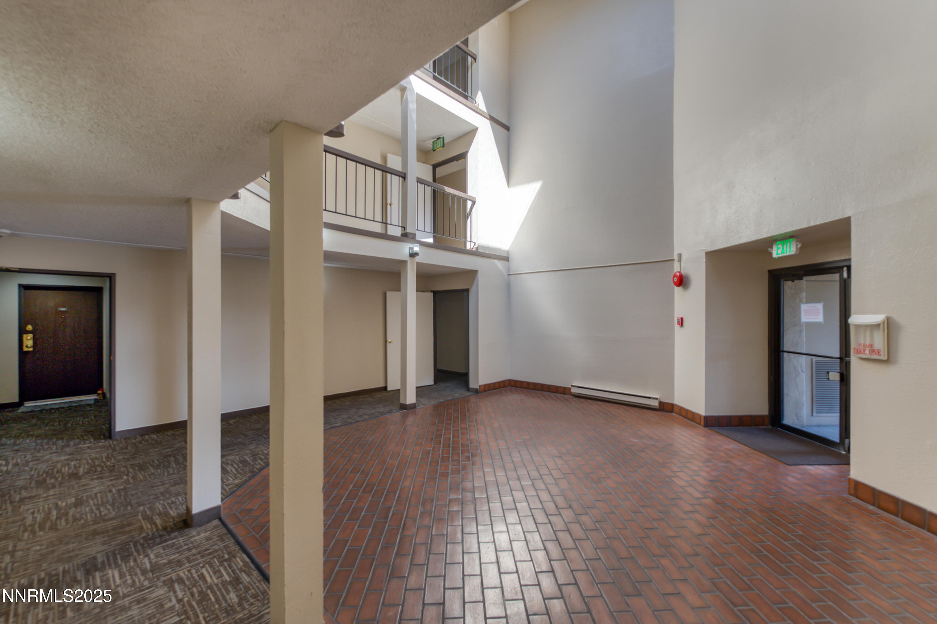 2450 Lymbery Street, Unit 213 Reno, NV 89509 - Photo 6 of 25 an empty room with wooden floor and windows