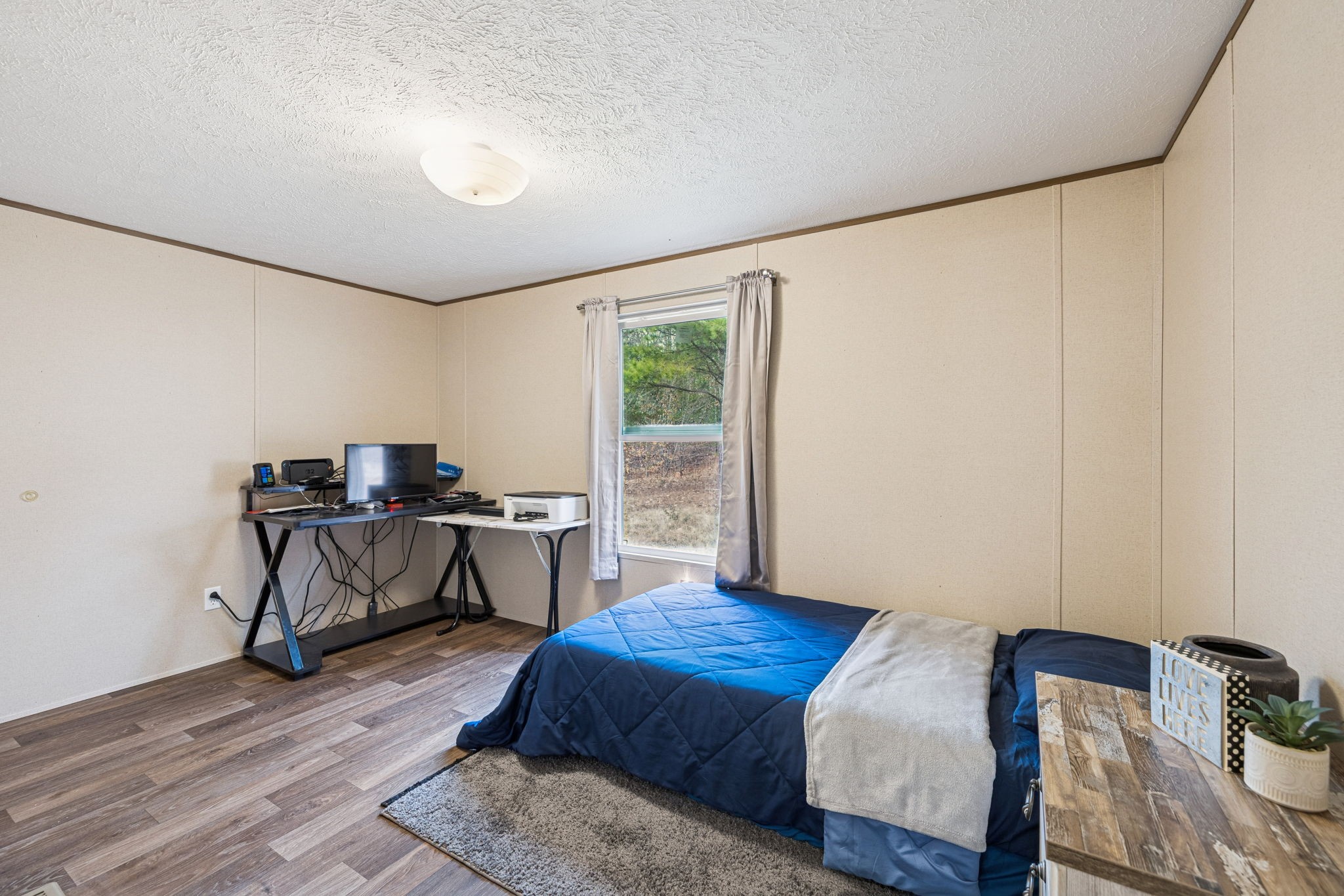 108 Lyell Road Hohenwald, TN 38462 - Photo 14 of 25 a bedroom with furniture and a window