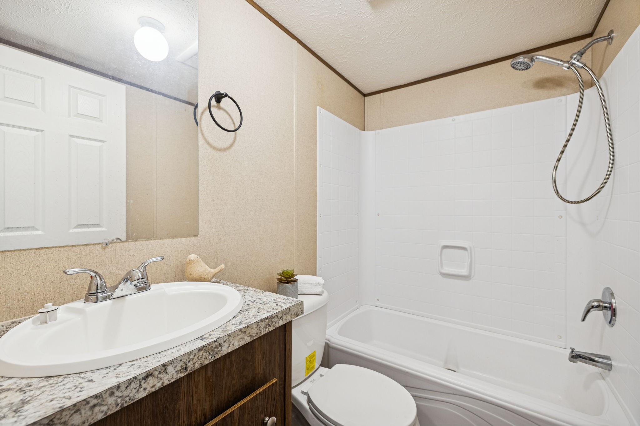 108 Lyell Road Hohenwald, TN 38462 - Photo 15 of 25 a bathroom with a granite countertop sink toilet and shower