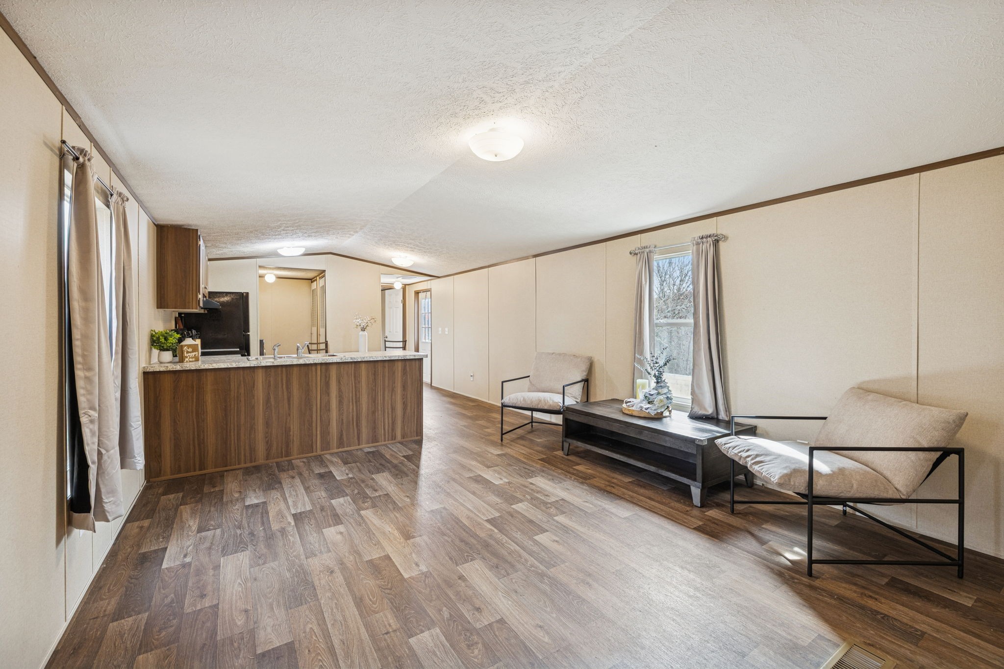 108 Lyell Road Hohenwald, TN 38462 - Photo 4 of 25 a living room with furniture and a wooden floor