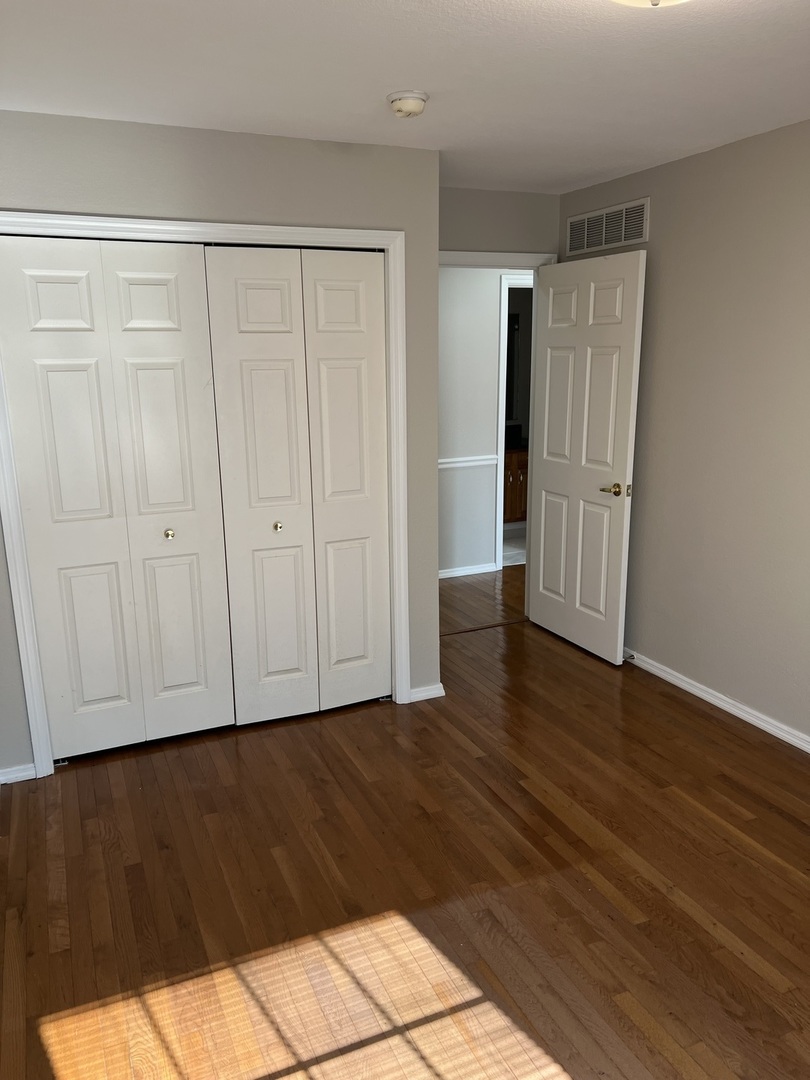3123 Brookstone Danville, IL 61832 - Photo 11 of 20 a view of an empty room with wooden floor