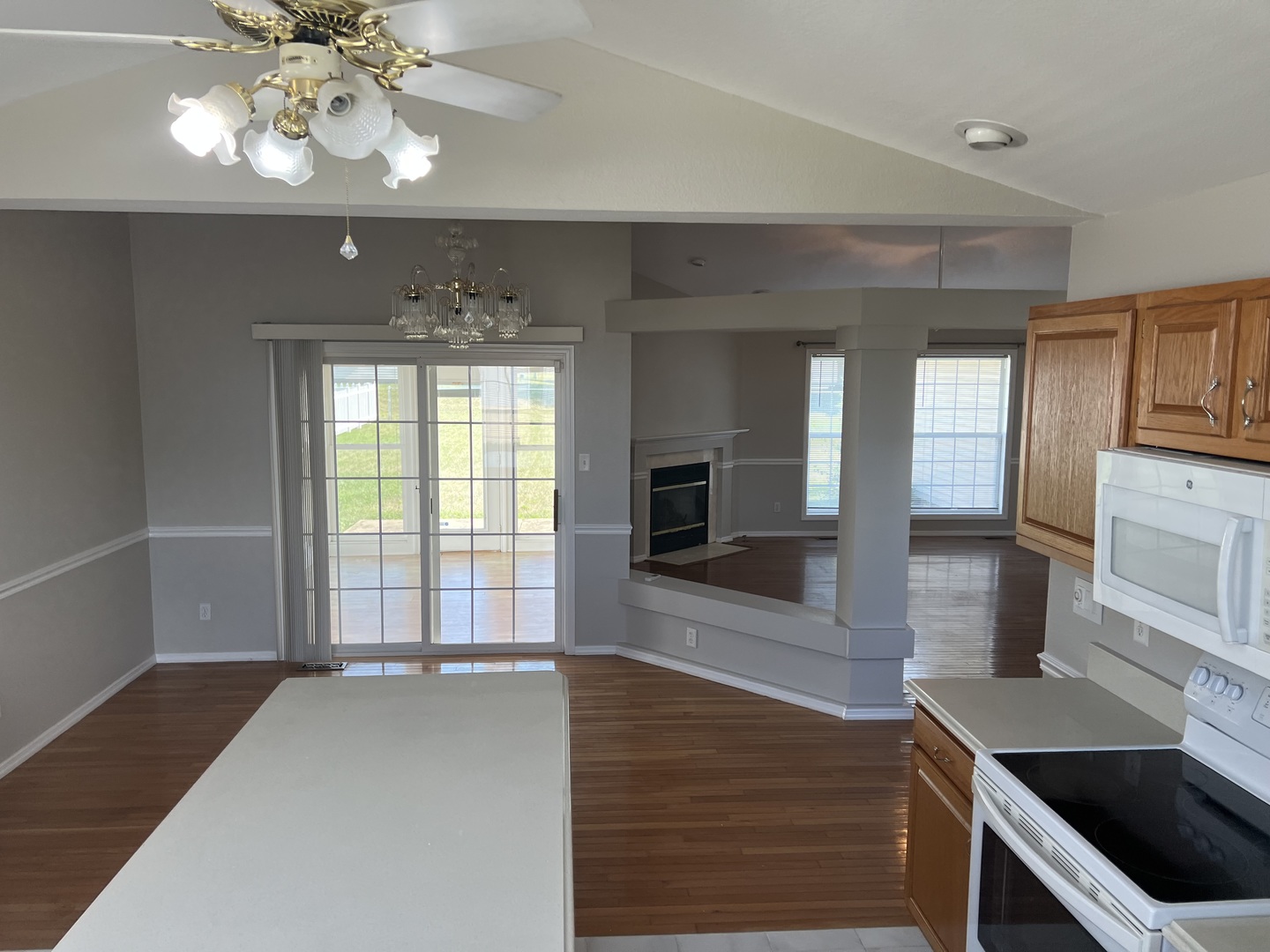 3123 Brookstone Danville, IL 61832 - Photo 4 of 20 a view of a kitchen with a sink cabinet and a fireplace