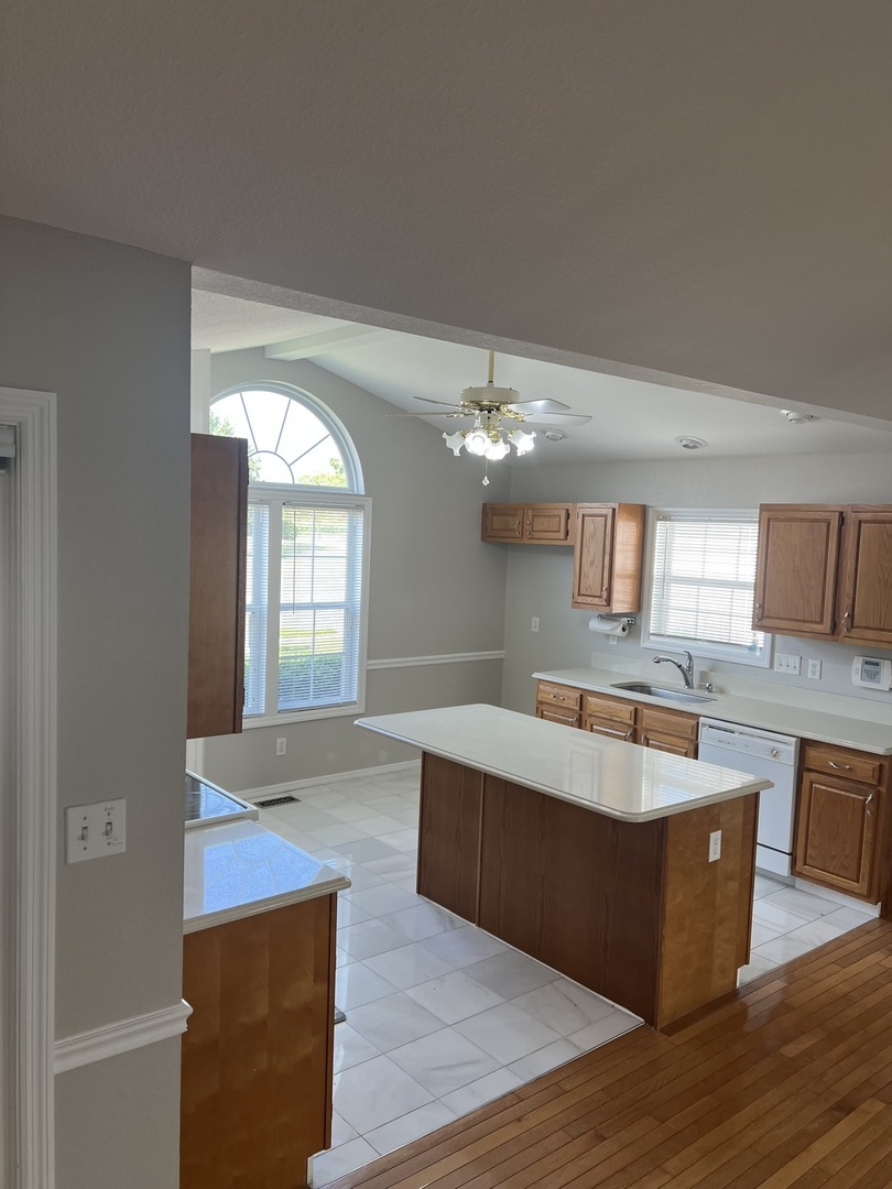 3123 Brookstone Danville, IL 61832 - Photo 5 of 20 a view of kitchen with granite countertop cabinets and wooden floor