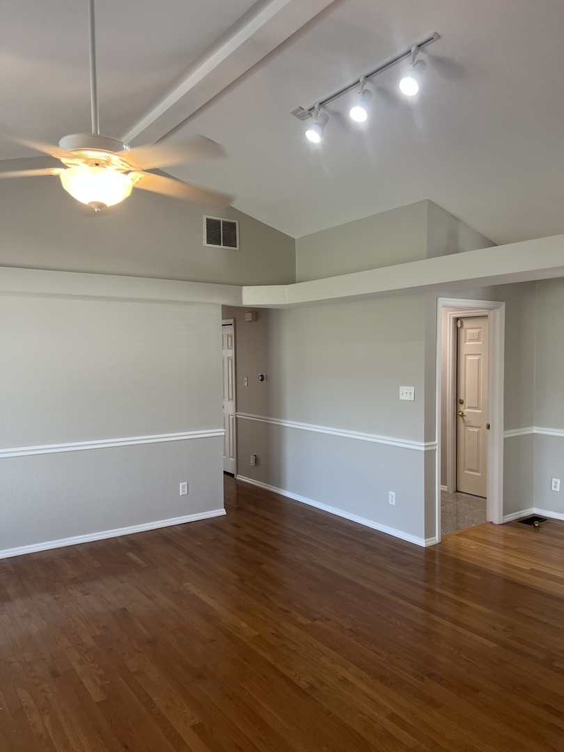 3123 Brookstone Danville, IL 61832 - Photo 10 of 20 an empty room with wooden floor and windows