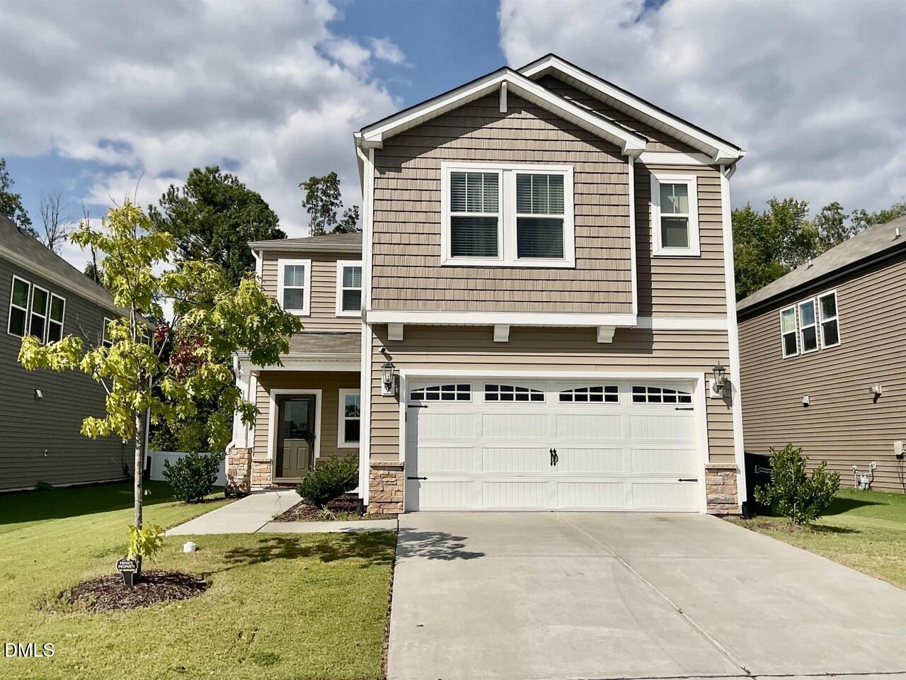 1807 Wrenn Road Durham, NC 27703 - Photo 1 of 43 a front view of a house with a yard