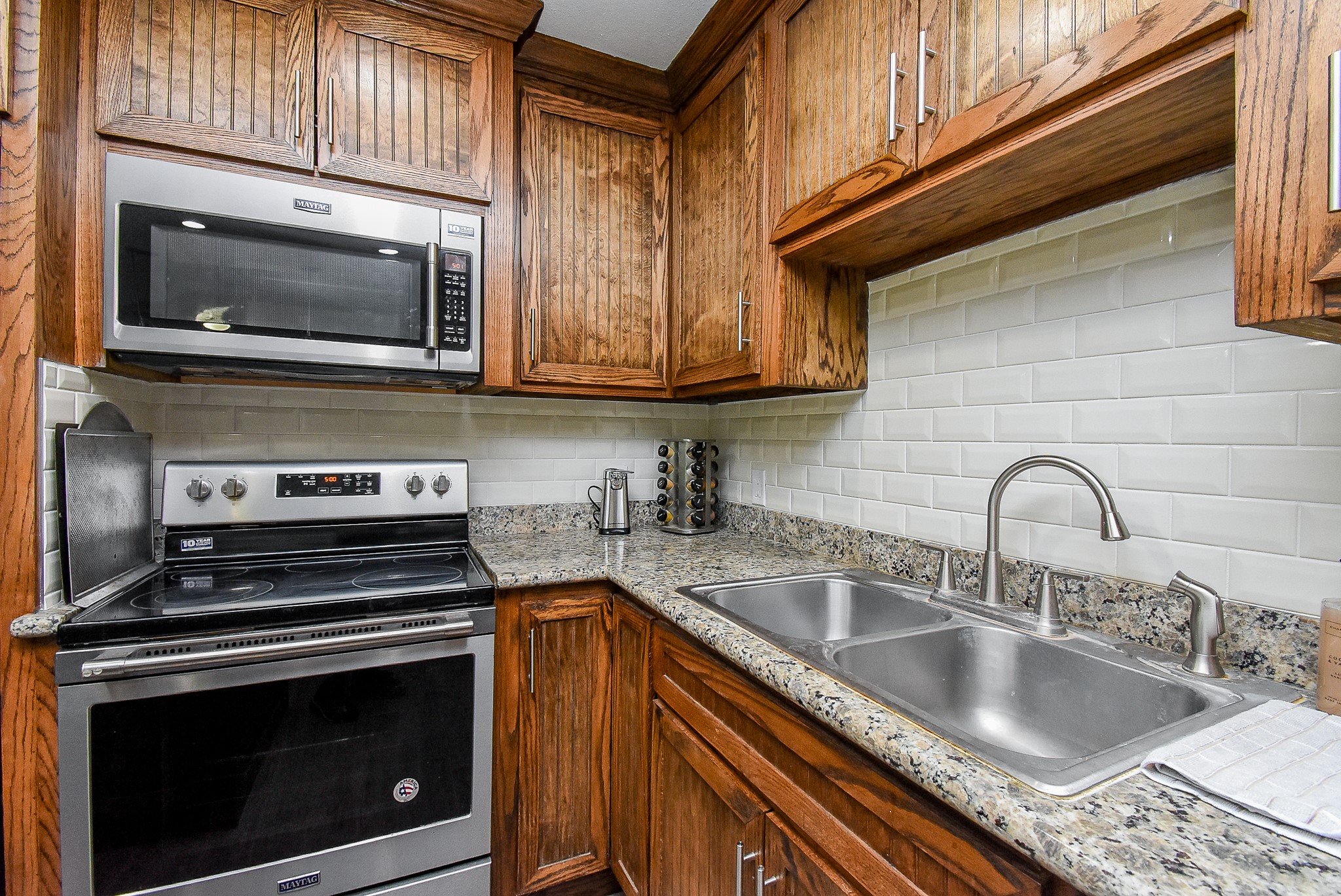 3818 County Road 36 Angleton, TX 77515 - Photo 14 of 49 a kitchen with granite countertop a stove and a sink