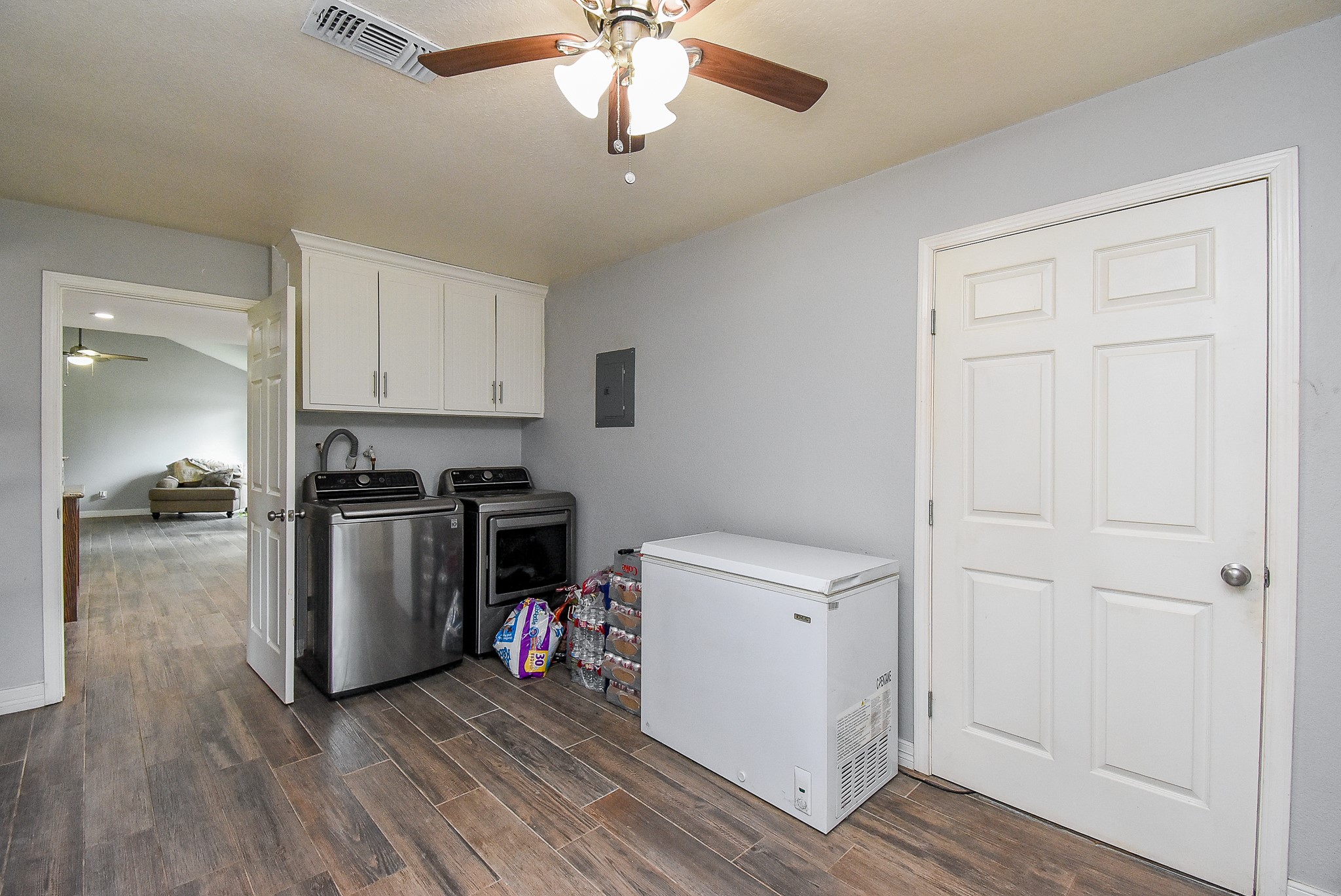 3818 County Road 36 Angleton, TX 77515 - Photo 17 of 49 a kitchen with a refrigerator and a stove top oven