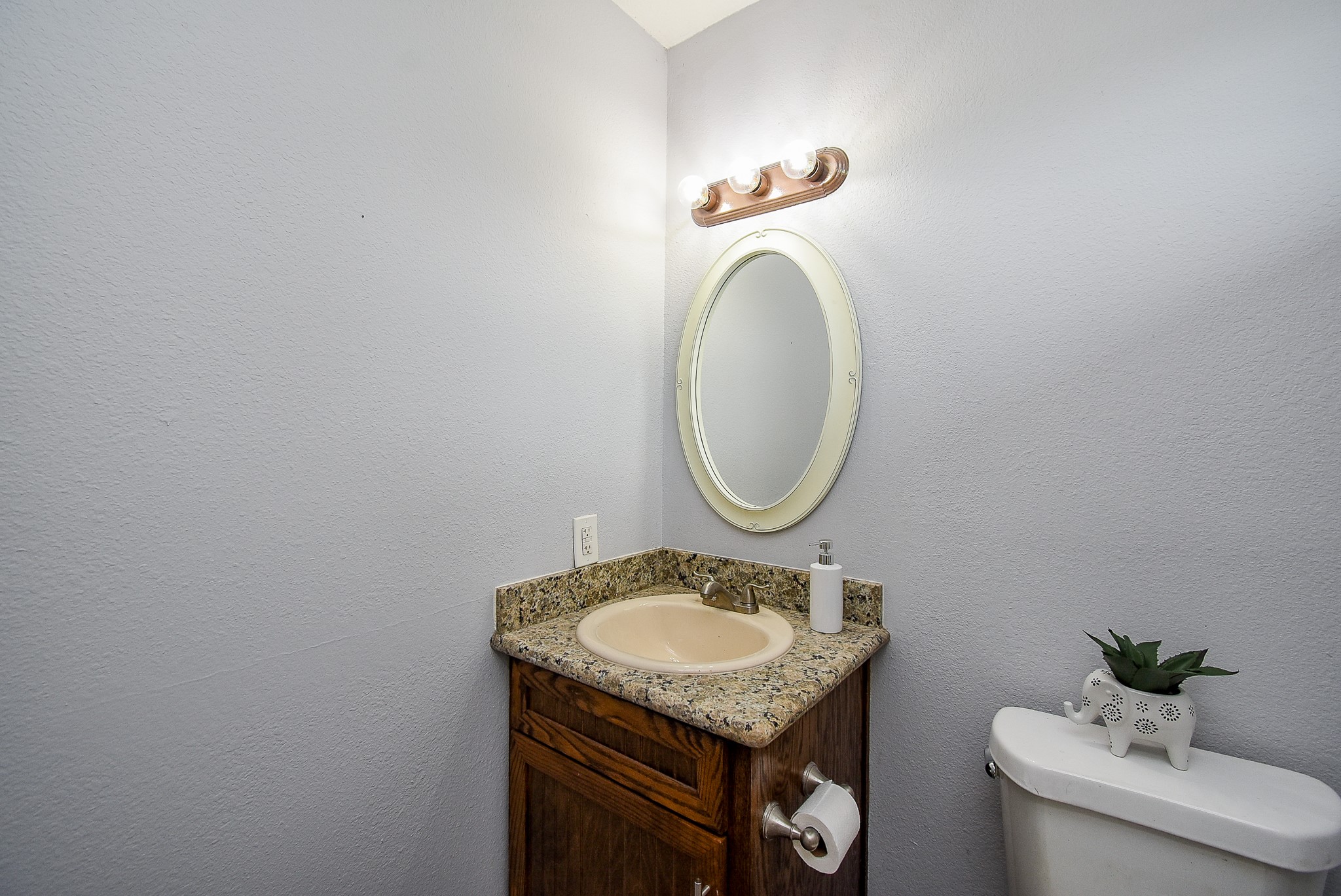 3818 County Road 36 Angleton, TX 77515 - Photo 18 of 49 a bathroom with a granite countertop sink and a mirror