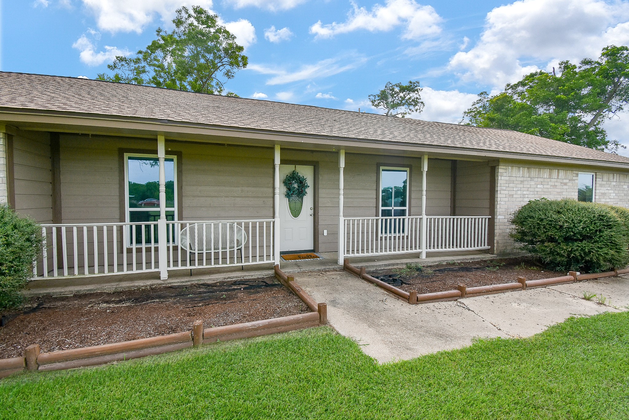 3818 County Road 36 Angleton, TX 77515 - Photo 2 of 49 front view of a house with a yard