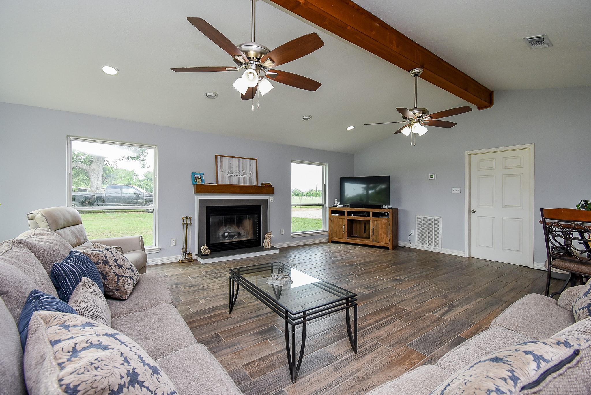 3818 County Road 36 Angleton, TX 77515 - Photo 22 of 49 a living room with furniture and a fireplace