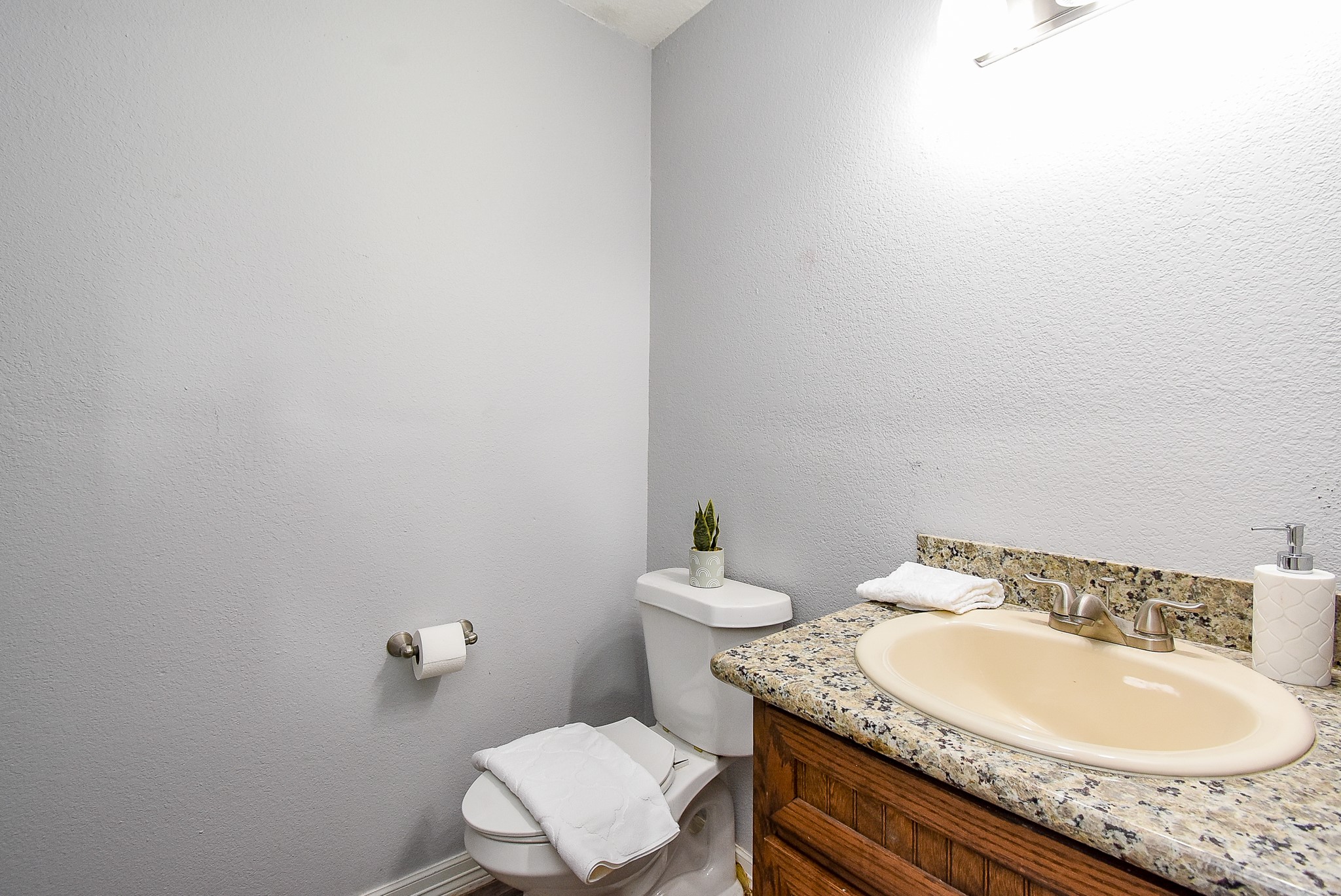 3818 County Road 36 Angleton, TX 77515 - Photo 26 of 49 a bathroom with a granite countertop sink and a mirror