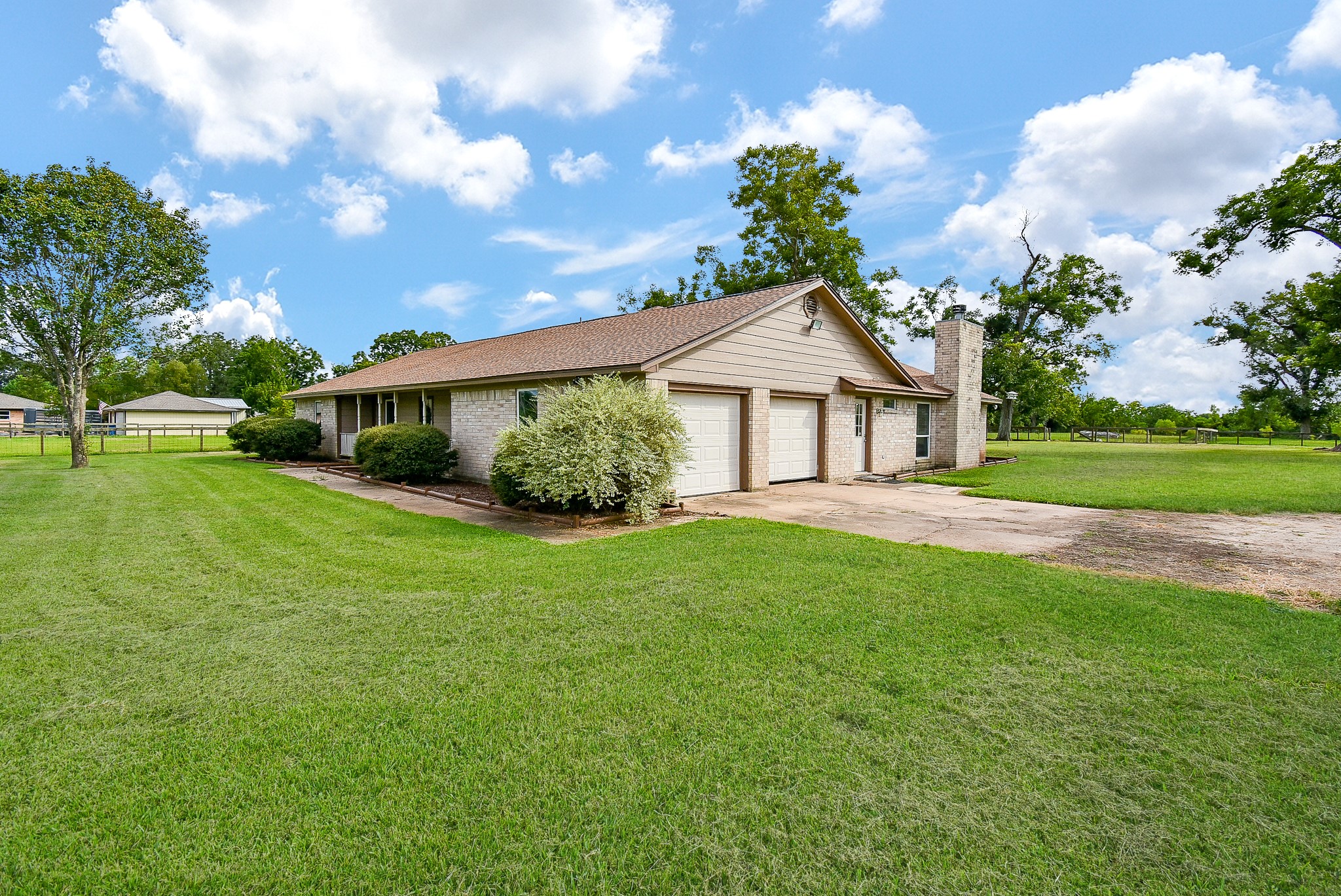 3818 County Road 36 Angleton, TX 77515 - Photo 3 of 49 a front view of a house with garden