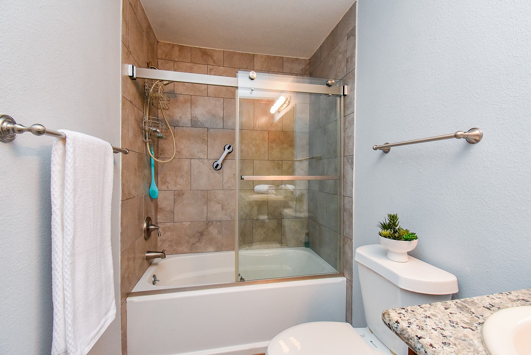 3818 County Road 36 Angleton, TX 77515 - Photo 31 of 49 a bathroom with a shower a toilet and a tub