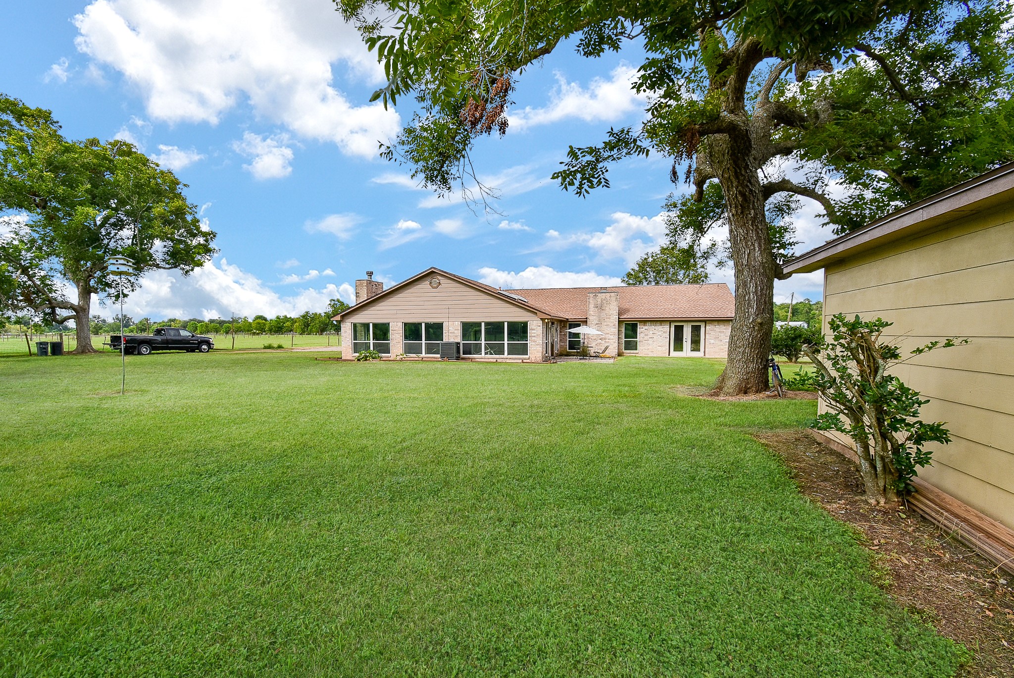3818 County Road 36 Angleton, TX 77515 - Photo 43 of 49 a front view of a house with garden