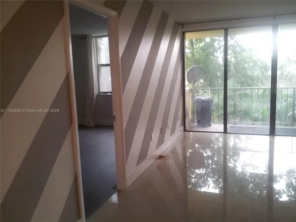 a view of empty room with windows