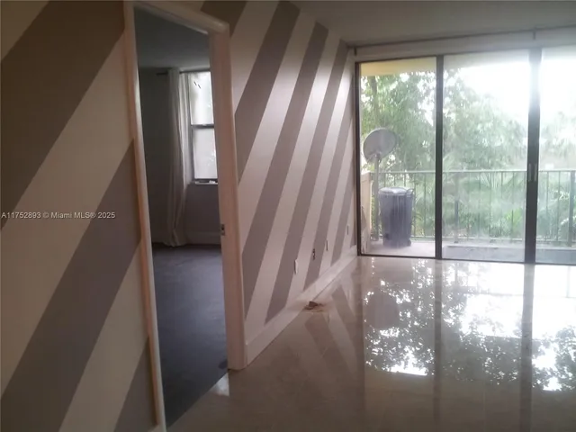 a view of empty room with windows