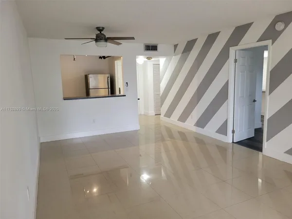 a view of a hallway view with staircase