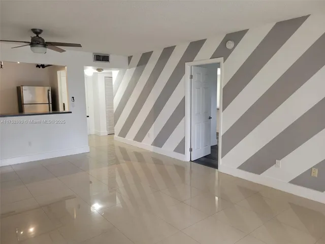 a view of a hallway view with staircase